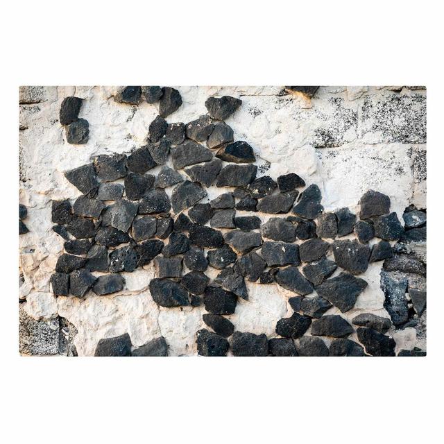 Wall with Black Stones by Uwe Merkel - Wrapped Canvas Photograph Ebern Designs Size: 100cm H x 150cm W on Productcaster.