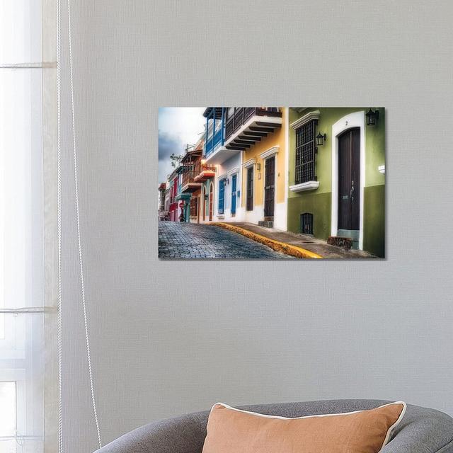 Low Angle View Of Houses On A Cobblestone Street by George Oze - Wrapped Canvas Painting Latitude Run Size: 45.72cm H x 66.04cm W x 3.81cm D on Productcaster.