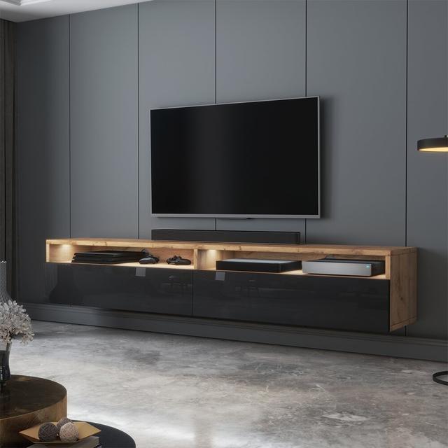 TV-Lowboard Rodley für TVs bis zu 78" Perspections Farbe: Wotan-Eiche und Schwarz in Hochglanz on Productcaster.