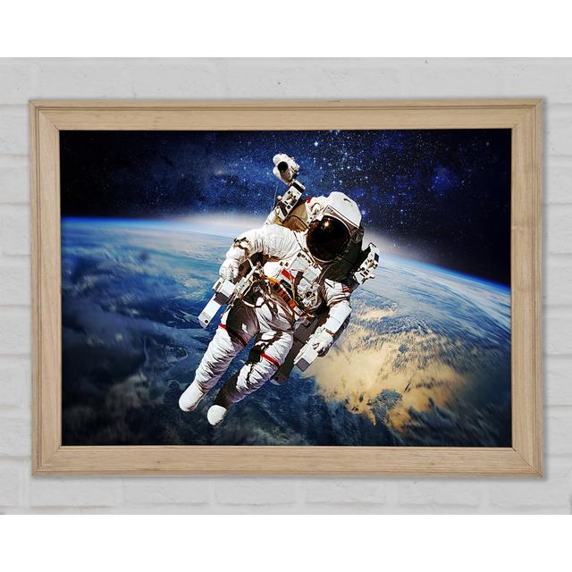 Astronaut Above The Earth Framed Print Happy Larry Size: 84.1cm H x 118.9cm W x 1.5cm D on Productcaster.