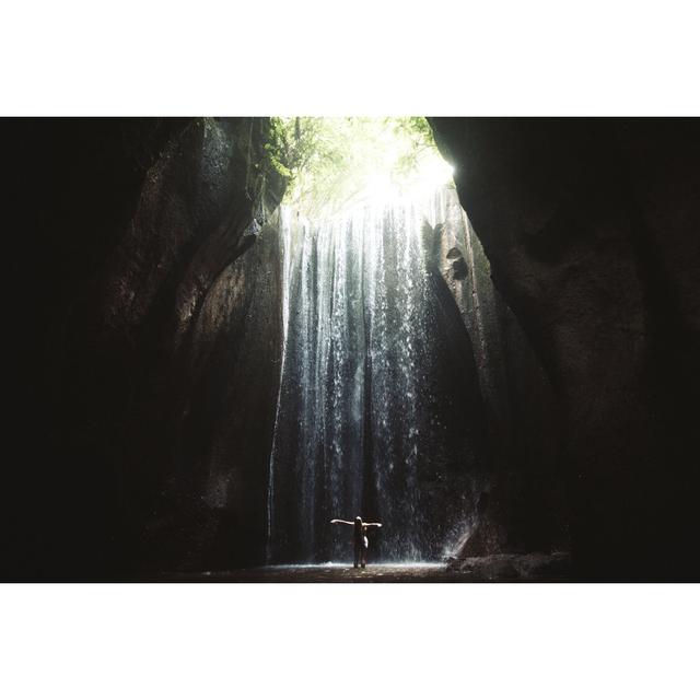 Woman Staying Under Hidden Waterfall by Anastasiia Shavshyna - Print Alpen Home Size: 20cm H x 30cm W on Productcaster.