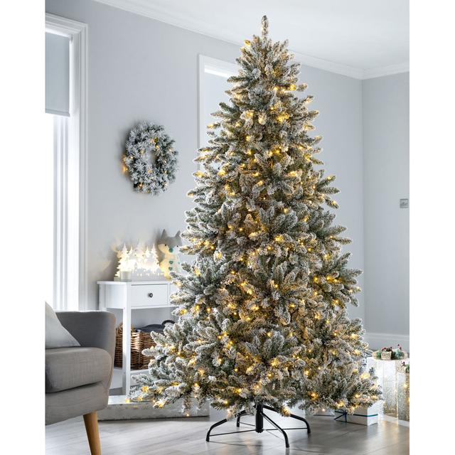 Pre-Lit Full Bodied Snow Flocked 6ft Green Artificial Christmas Tree with 350 Warm White Lights with Stand The Seasonal Aisle on Productcaster.