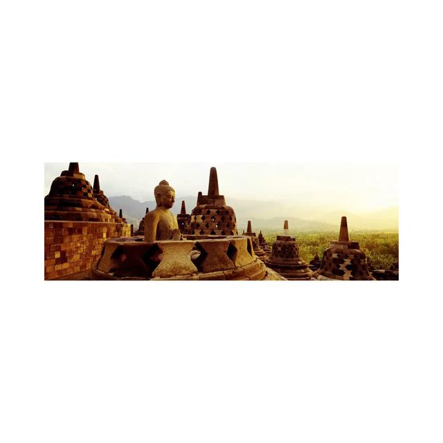 Indonesia, Java, Borobudur Temple - Wrapped Canvas Panoramic Photograph Ebern Designs Size: 50.8cm H x 152.4cm W x 1.91cm D on Productcaster.