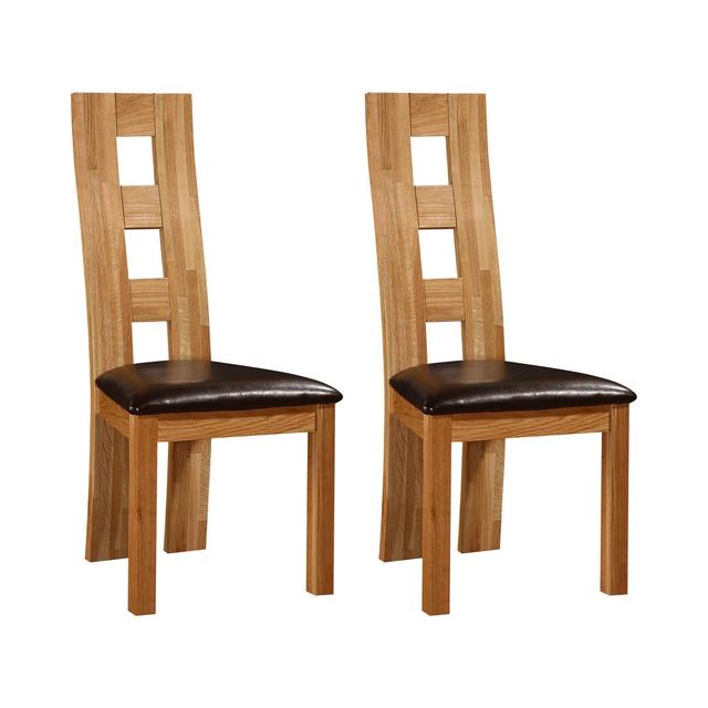 2-Piece Upholstered Dining Chair Set made of Faux Leather in Oak with Solid Back by Alpen Home on Productcaster.