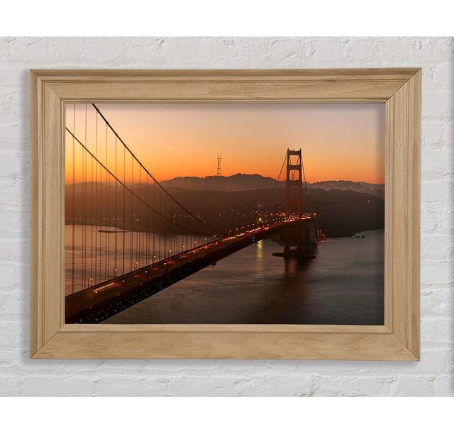 Gerahmtes Leinwandbild Gate Bridge Sunset Glow ModernMoments Format: Poster mit Naturholz-Rahmen, Größe: 100cm H x 141,4cm B x 8cm T on Productcaster.