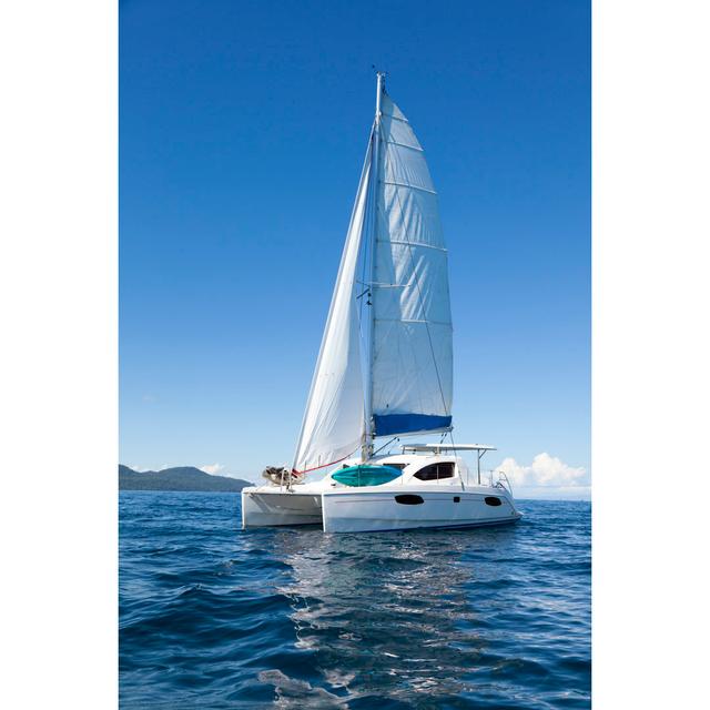 Catamaran At Sea Longshore Tides Size: 122cm H x 81cm W x 3.8cm D on Productcaster.