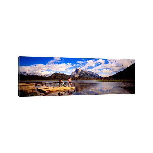 Mountain Bikers Vermilion Lakes Alberta Canada - Wrapped Canvas Panoramic Print Union Rustic Size: 50.8cm H x 152.4cm W x 3.81cm D on Productcaster.