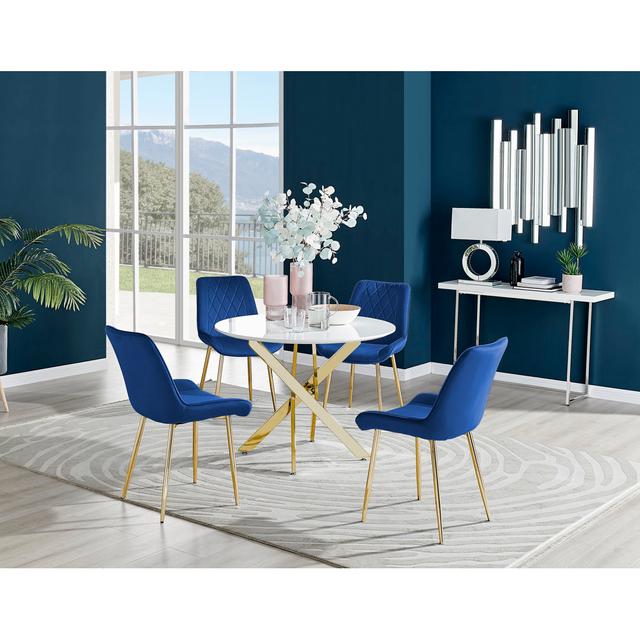 Tierra Modern Metal & Glass Round Dining Table Set with 4 Luxury Dining Chairs Canora Grey Chair Colour: Navy/Gold on Productcaster.