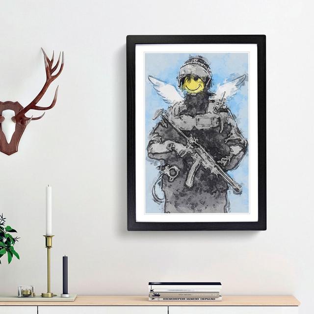 Smiley Policeman by Banksy - Picture Frame Painting Print East Urban Home Frame Option: Black Framed, Size: 65cm H x 48cm W x 2cm D on Productcaster.