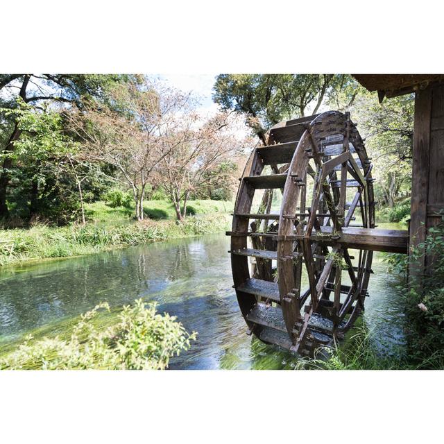 Ancient Water Wheel Within Serene And Scenic River by ThamKC - Wrapped Canvas Print Union Rustic Size: 61cm H x 91cm W on Productcaster.