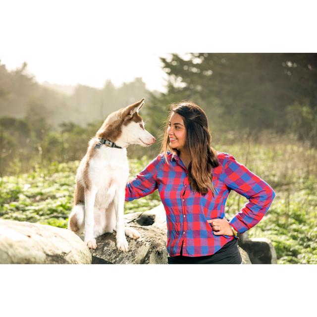 Smiling Happy Hispanic Woman And Siberian Husky In The Park by JasonDoiy - No Frame Art Prints on Canvas 17 Stories Size: 50cm H x 75cm W on Productcaster.