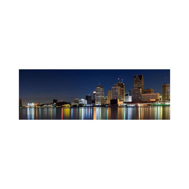 Buildings In A City Lit Up At Dusk, Detroit River, Detroit, Michigan, USA - Wrapped Canvas Panoramic Print Ebern Designs Size: 50.8cm H x 152.4cm W x on Productcaster.