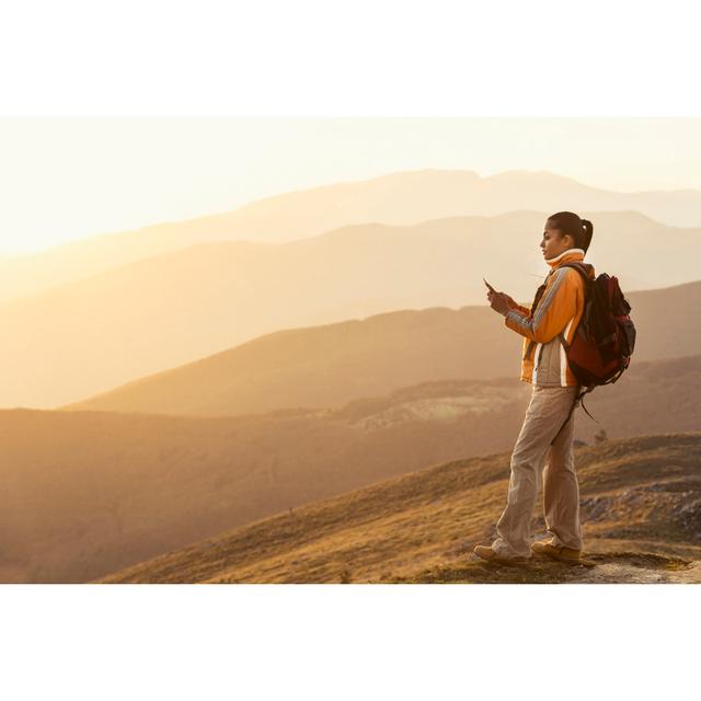 Backpacker With Smart Phone Standing On Top Mountain by Vladimir Vladimirov - No Frame Print on Canvas Alpen Home Size: 51cm H x 76cm W on Productcaster.