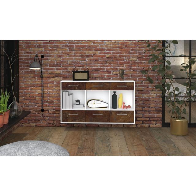 The Myella sideboard is made from oak and white. It features a flying metal handle and measures 136cm x 79cm x 35cm Ebern Designs Colour: Rust/White on Productcaster.