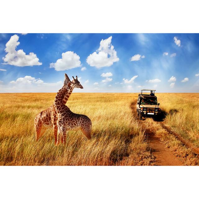 Group Of Wild Giraffes In African Savannah Against Blue Sky With Clouds Near The Road. Tanzania. National Park Serengeti. - Wrapped Canvas Print Ebern on Productcaster.