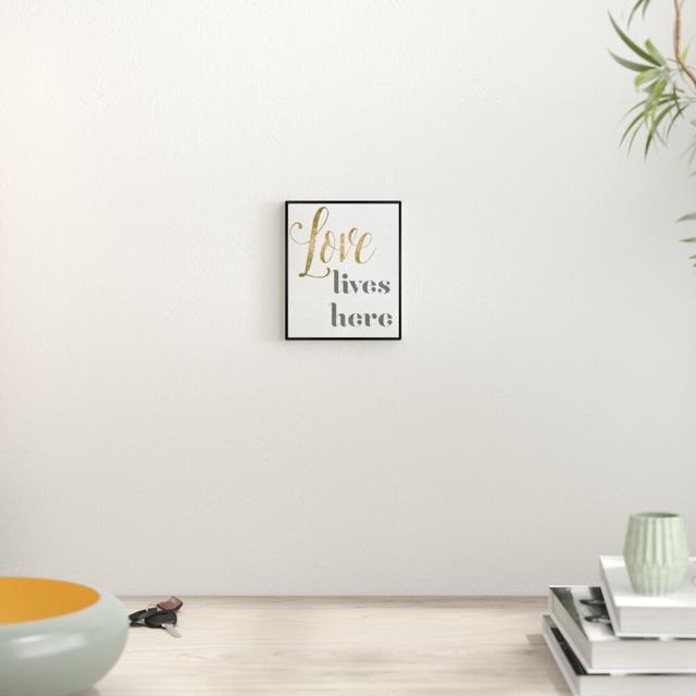 Love Lives Here - Typography Print East Urban Home Size: 45.72cm H x 38.1cm W x 1.27cm D, Format: Black Framed on Productcaster.