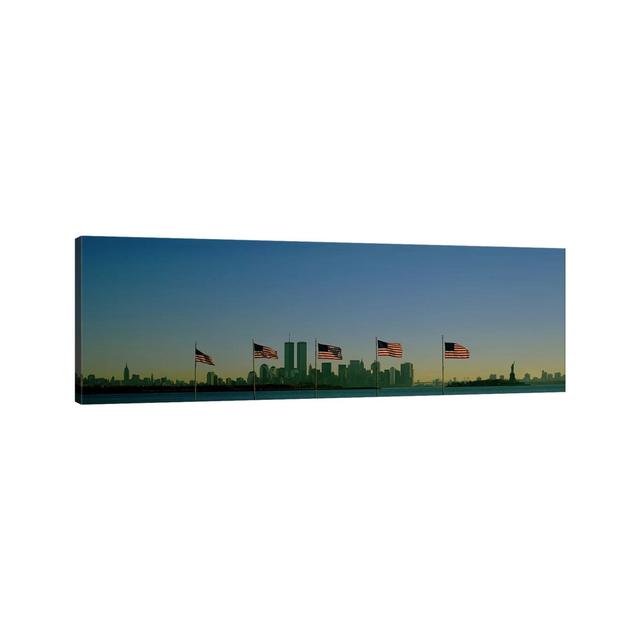 View Of Manhattan Through A Row Of American Flags At Flag Plaza, Liberty State Park, New Jersey by Panoramic Images - Wrapped Canvas Panoramic Print E on Productcaster.