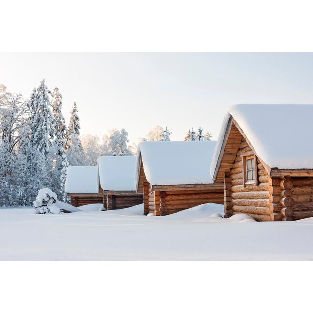 Snowy Log Cabins - Wrapped Canvas Photograph 17 Stories Size: 20cm H x 30cm W on Productcaster.