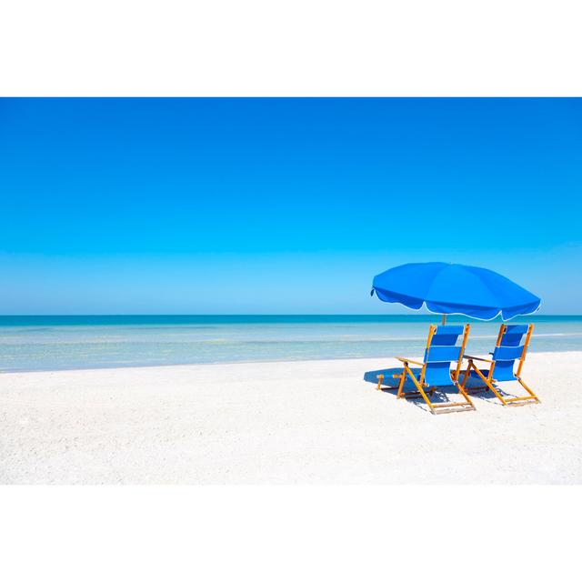 Lounge Chairs At Beach by Bertlmann - Print House of Hampton Size: 80cm H x 120cm W on Productcaster.