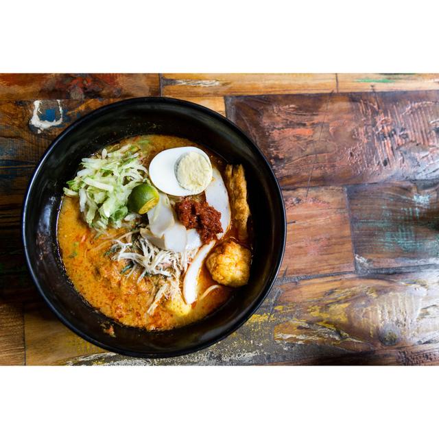 Serving Of Nyonya Laksa, Popular Spicy Noodle Soup In Malaysia - Wrapped Canvas Print Ebern Designs Size: 51cm H x 76cm W x 3.8cm D on Productcaster.