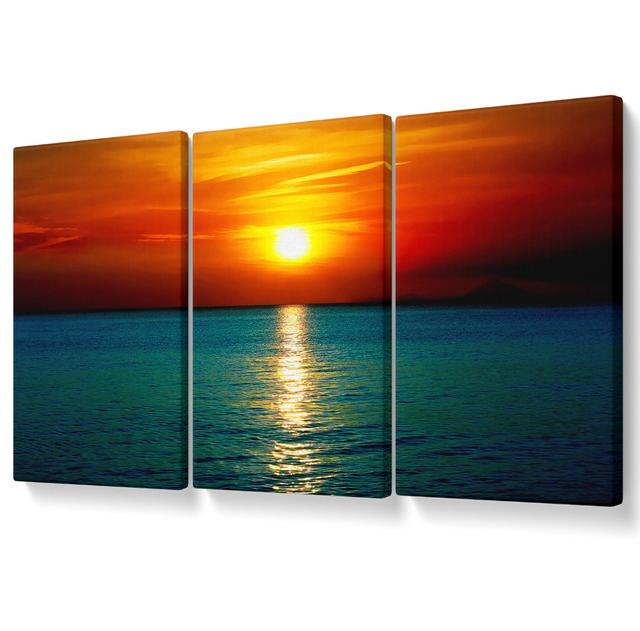 As The Sun Goes Down Over The Turquoise Ocean Canvas 3 Panel Set Highland Dunes Size: 101.6cm H x 203cm W on Productcaster.