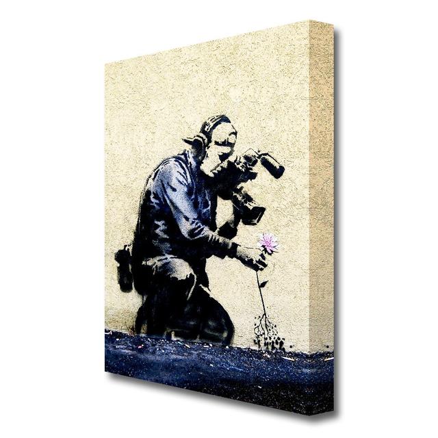 Pulling the Roots of Life by Banksy - Wrapped Canvas Graphic Art Print East Urban Home Size: 81.3cm H x 50.8cm W x 4.4cm D, Format: Wrapped Canvas on Productcaster.