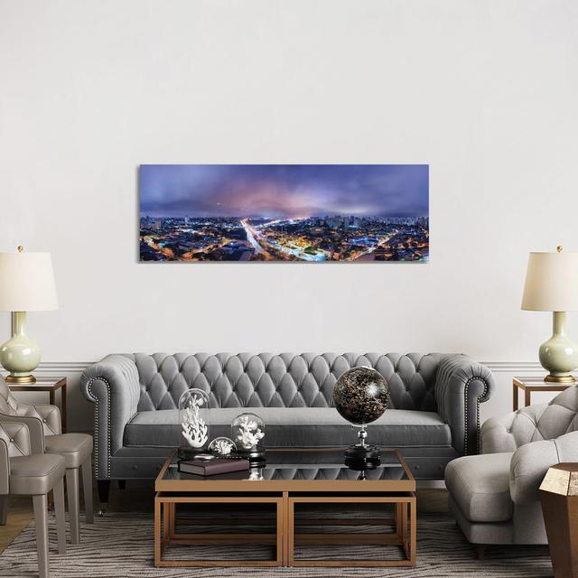 Night Cityscape Pano by Glauco Meneghelli - Wrapped Canvas Panoramic Graphic Art Brayden Studio Size: 50.8cm H x 152.4cm W x 3.81cm D on Productcaster.