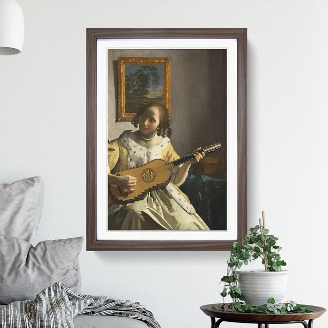 Girl Playing Instrument by Johannes Vermeer - Picture Frame Painting East Urban Home Size: 48cm H x 36cm W x 2cm D, Frame Option: Walnut Framed on Productcaster.