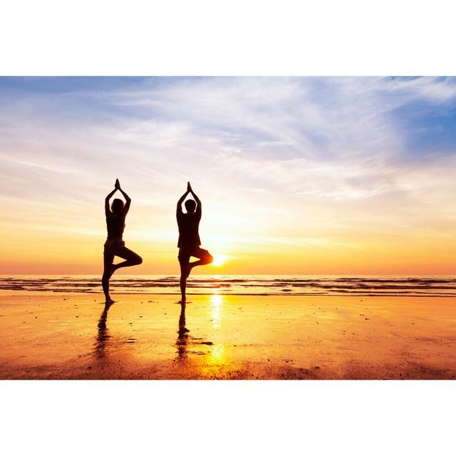 Two People Practicing Yoga Tree Position On The Beach, Sunset Highland Dunes Size: 51cm H x 76cm W on Productcaster.