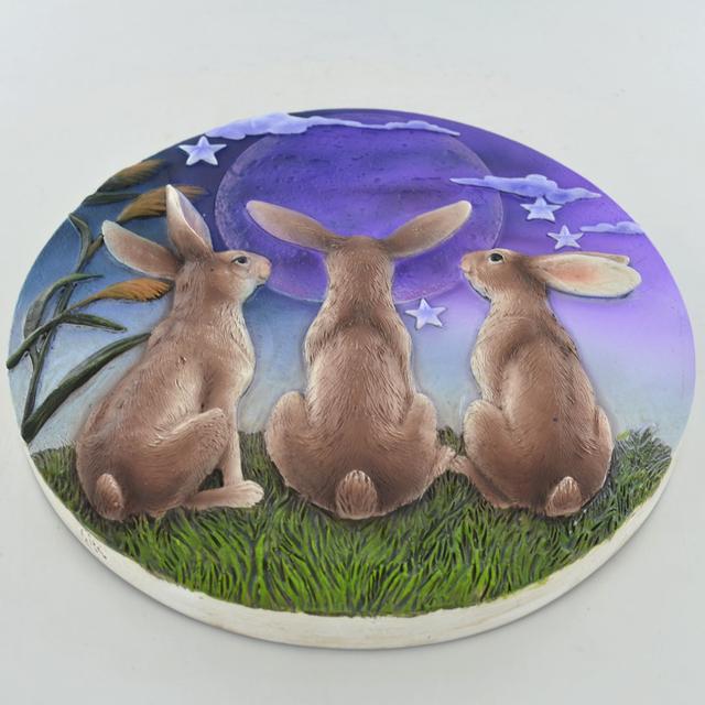 Three Hares Gazing Round Stone-effect Plaque Wall Décor August Grove on Productcaster.