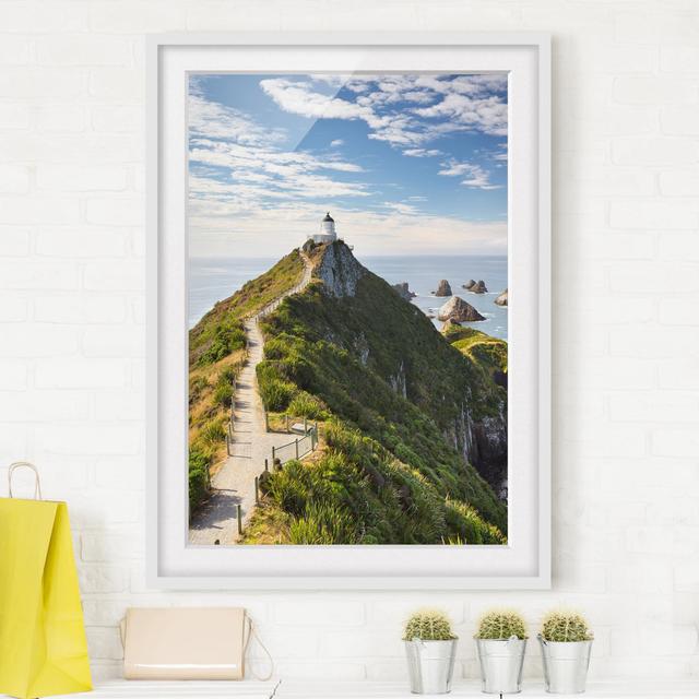 Nugget Point Lighthouse in New Zealand Framed Photographic Print Poster East Urban Home Frame Options: Matt white, Size: 70cm H x 50cm W on Productcaster.