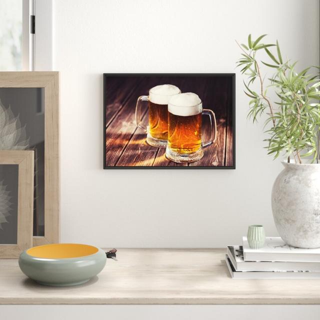 Gerahmtes Wandbild Zwei Maßkrüge Bier East Urban Home Größe: 70 cm H x 100 cm B on Productcaster.