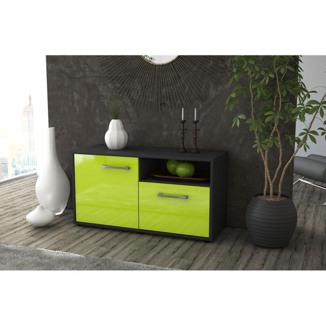 The Murvin TV Stand is made of oak and anthracite 17 Stories Colour: Green and anthracite on Productcaster.