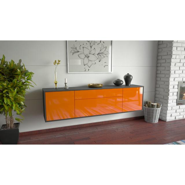 TV-Lowboard Goudeau für TVs bis zu 78" Ebern Designs Farbe: Schwarz/Orange on Productcaster.