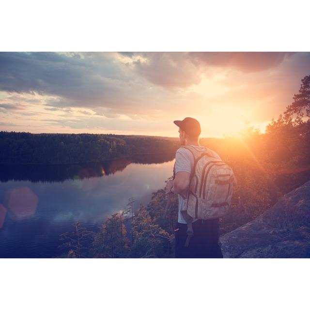 Man With Backpack Looking At Sunset by Littlehenrabi - Wrapped Canvas Print Union Rustic Size: 81cm H x 122cm W x 3.8cm D on Productcaster.