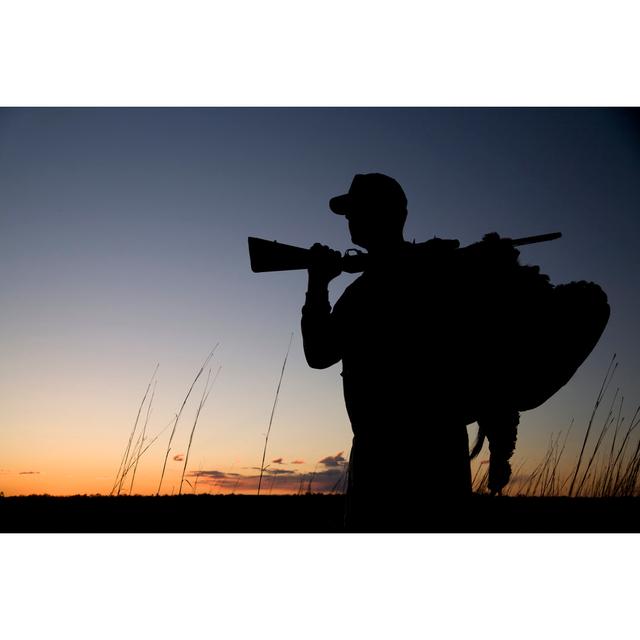 Silhouette Of A Hunter At Sunset by JonHuelskamp - Drucken 17 Stories Größe: 40 cm H x 60 cm B on Productcaster.