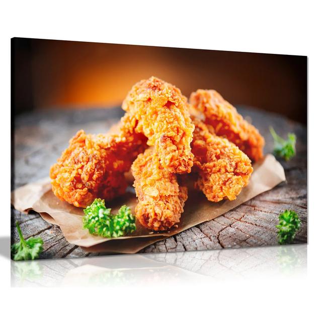 Tasty Fried Chicken On Wooden Table - Wrapped Canvas Print Ebern Designs Size: 31cm H x 46cm W on Productcaster.