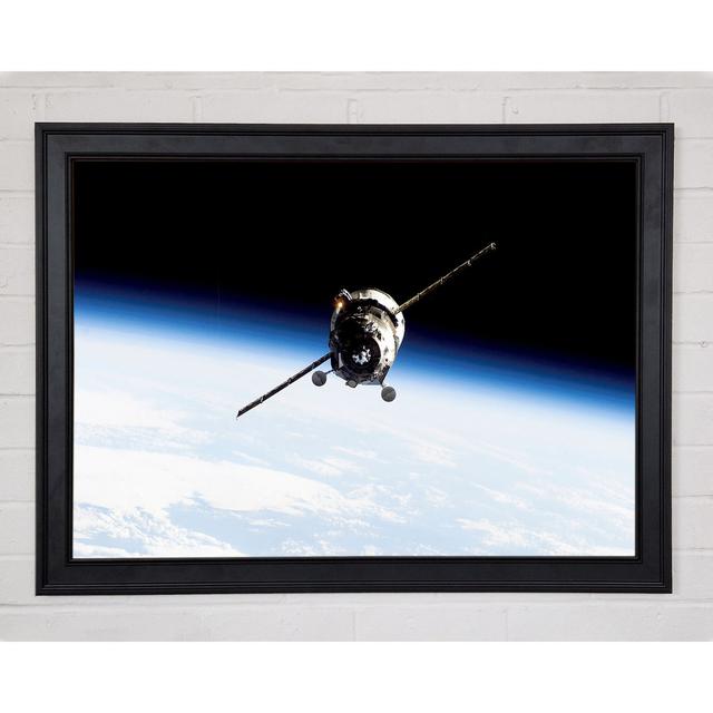 Orbiting The Earth Framed Print Ebern Designs Size: 21" H x 29.7" W x 1.5" D on Productcaster.