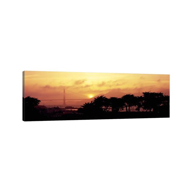 Silhouette of Trees at Dusk with a Bridge in the Background, Golden Gate Bridge - Wrapped Canvas Panoramic Photograph Ebern Designs Size: 30.48cm H x on Productcaster.