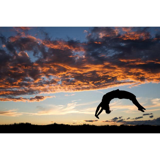 Gymnast In Sunset Doing A Back Handspring - Wrapped Canvas Print Ebern Designs Size: 81cm H x 122cm W on Productcaster.