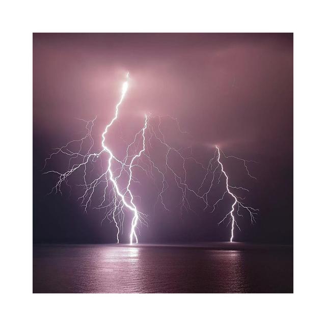 Thunderbolt Over The Sea by Nini Filippini - Wrapped Canvas Gallery-Wrapped Canvas Giclée Latitude Run Size: 45.72cm H x 45.72cm W x 1.91cm D on Productcaster.