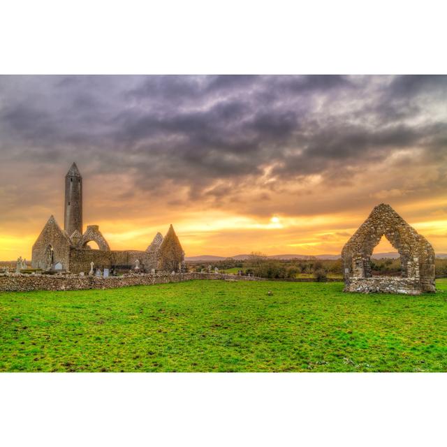 Kilmacduagh Monastery With Stone Tower At Sunset by Patryk_Kosmider - Wrapped Canvas Print Ebern Designs Size: 61cm H x 91cm W x 3.8cm D on Productcaster.