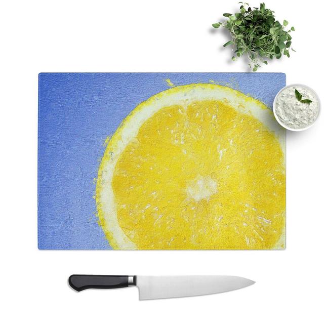 Glass Lemon Slice Chopping Board East Urban Home Size: 39 cm W x 28.5 cm L on Productcaster.