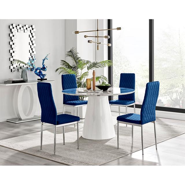 Edzard Statement Pedestal Round Dining Table Set & 4 Luxury Velvet Dining Chairs Furniture Box Chair Colour: Navy/Silver on Productcaster.