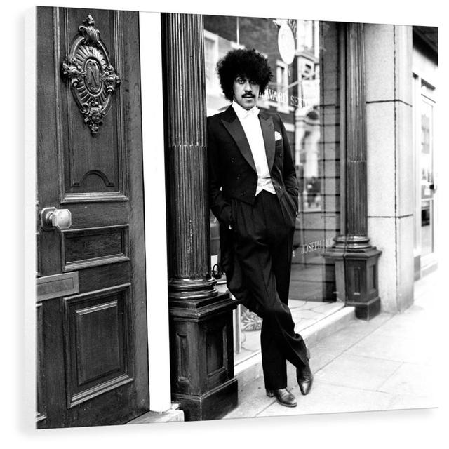 Phil Lynott in London, Modelling Clothes from Saville Row. 1983 by Maloney - Photograph Print George Oliver Size: 40 cm H x 39.4 cm W x 3.8 cm D, Form on Productcaster.