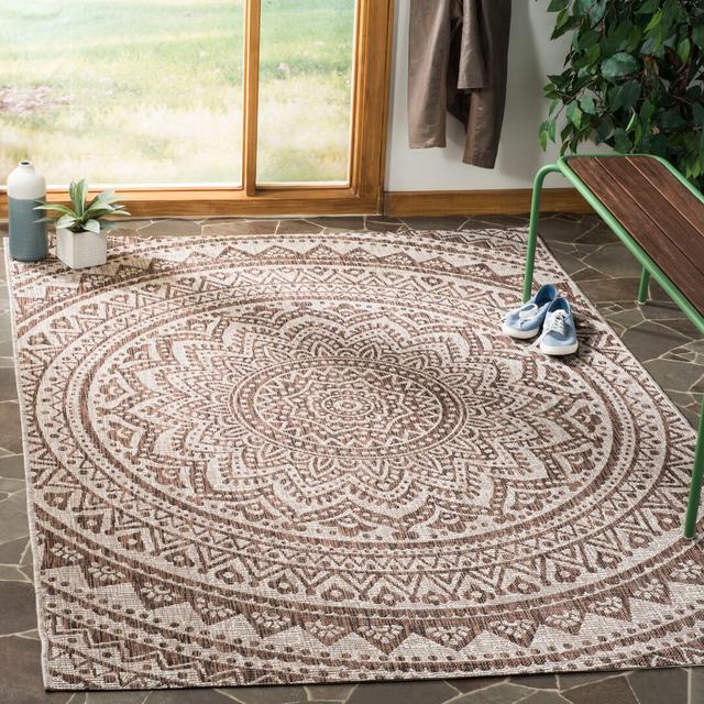 Looped Rug in Beige with Damask Pattern for Outdoor Use by World Menagerie on Productcaster.