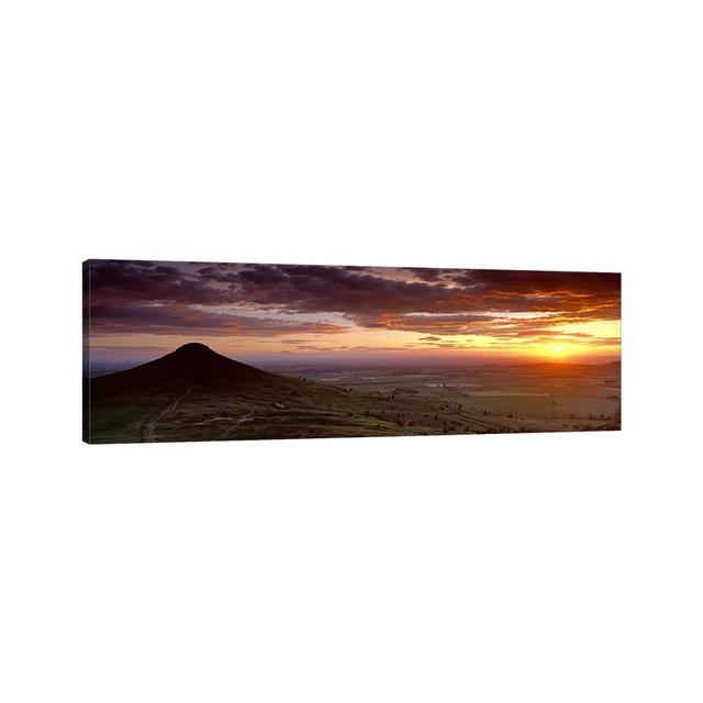 Silhouette Of A Hill At Sunset, Roseberry Topping, North Yorkshire, Cleveland - Wrapped Canvas Panoramic Print Union Rustic Size: 50.8cm H x 152.4cm W on Productcaster.