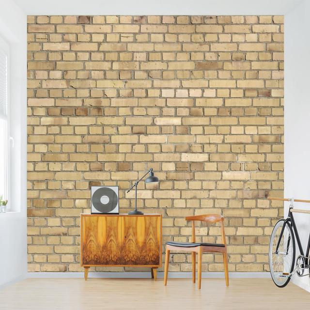 Strukturierte Fototapete Bright Yellow Brick Wall 2,4 m x 240 cm East Urban Home on Productcaster.