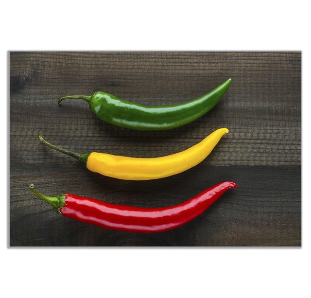 Three Jamaican Chilli Peppers Kitchen Canvas Wall Art Picture Print Panther Print Size: 41cm H x 61cm W on Productcaster.