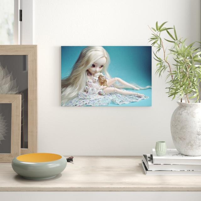 Leinwandbild „Blonde Pullip-Puppe mit Vogelkäfig" von kumo, Fotodruck East Urban Home Größe: 70 cm H x 100 cm B on Productcaster.